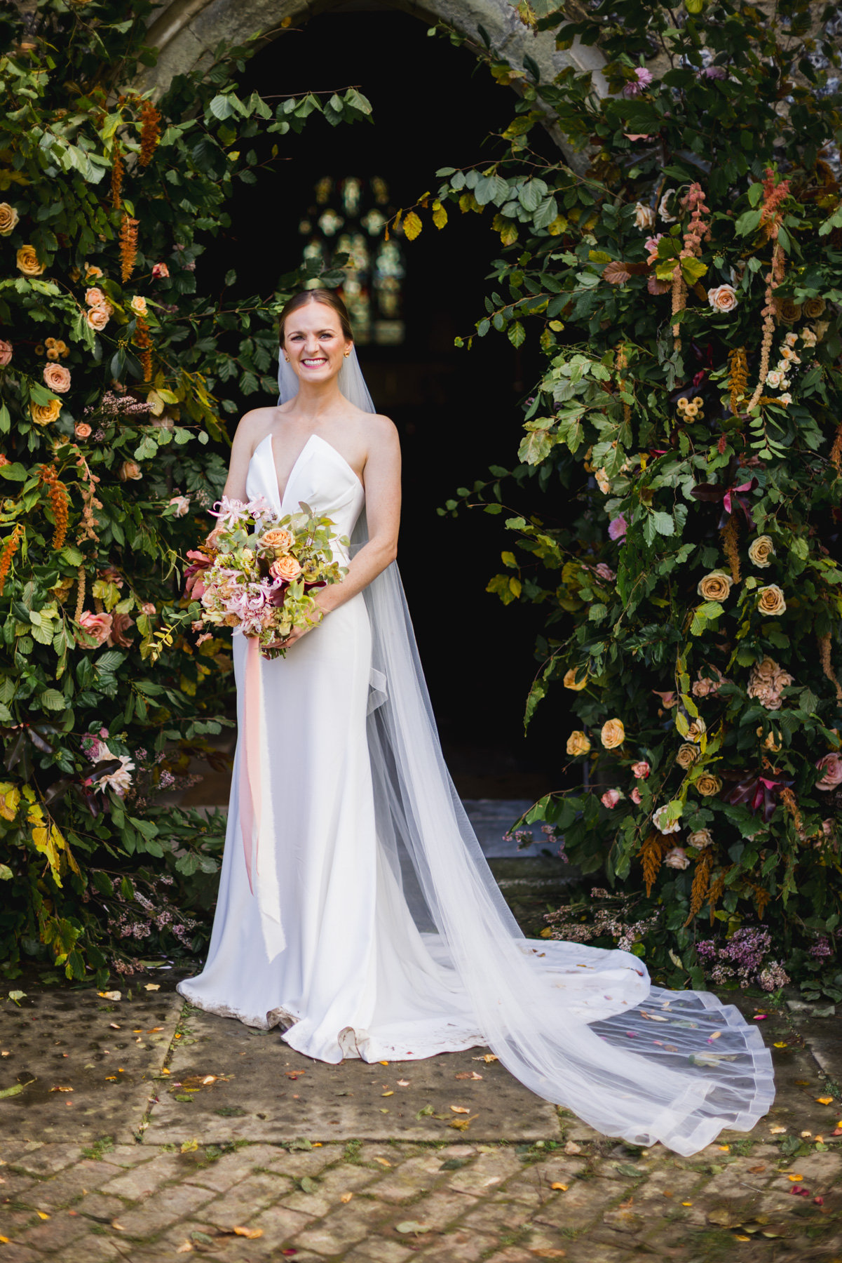 Bridal Portrait with florals outside St Peters Church Firle