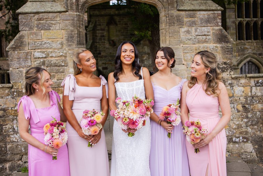Bride and bridesmaids portrait at Nymans